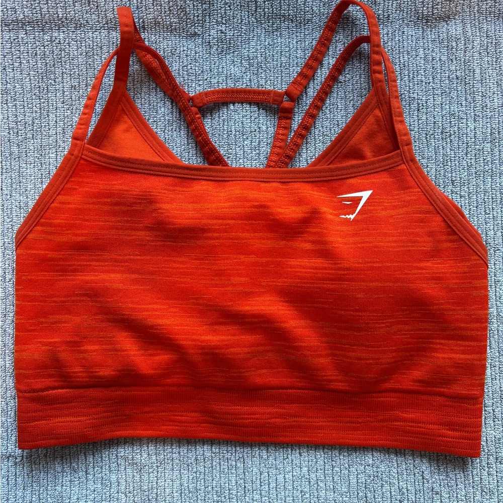 Gymshark padded sports bra. Bright orange in color. Size medium.